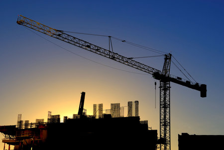 Construction crane with building under construction, downtown San Diego, California, USA