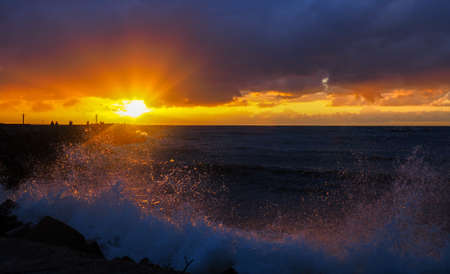 Sunset reflections in the wavesの写真素材