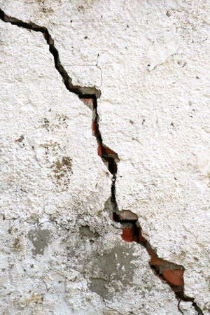 old wall texture with a huge crackの写真素材