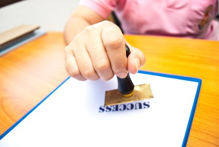 Rubber stamp on handの写真素材