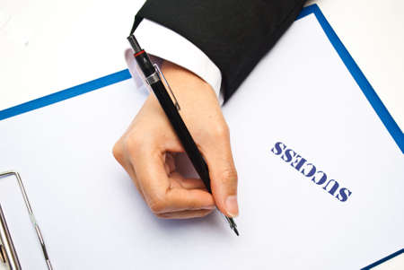 Hand writing with successの写真素材