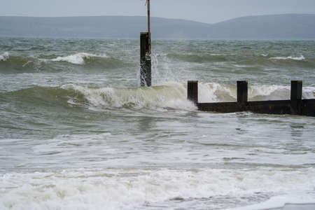 Stormy Baltic sea with waves crashing on the breakwater, Latviaの写真素材