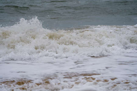 Sea waves on the seashore. Waves splash on the shore.の写真素材