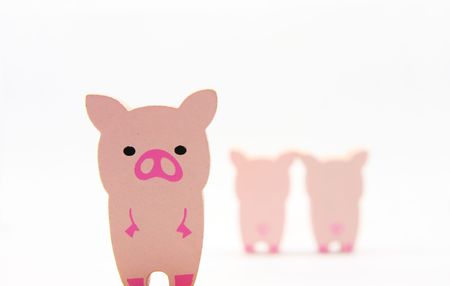Wooded pig toys pair and abandonの写真素材