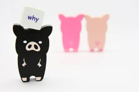 Wooded pig toys pair and abandonの写真素材