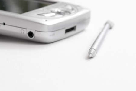 pocket pc silver on white backgroundの写真素材