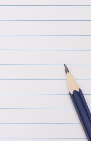 blue pencil on clean lined notebookの写真素材