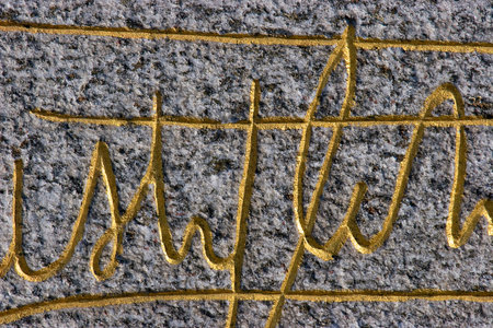 old signature on stone background texture