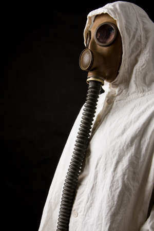Person in gas mask on dark backgroundの写真素材