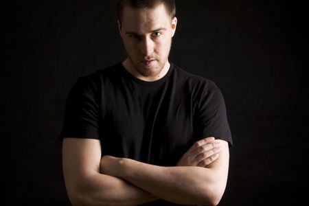 young man portrait on black backgroundの写真素材