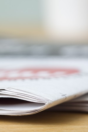 newspaper on wooden tableの写真素材