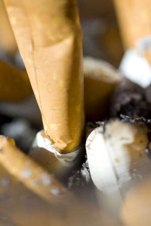 Ashtray full of cigarette buttsの写真素材