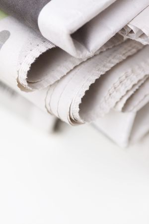 pile of newspapers on white tableの写真素材