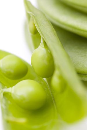 close-up fo opened green bean pod with selective focusの写真素材