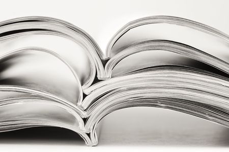 stack of magazines on white backgroundの写真素材