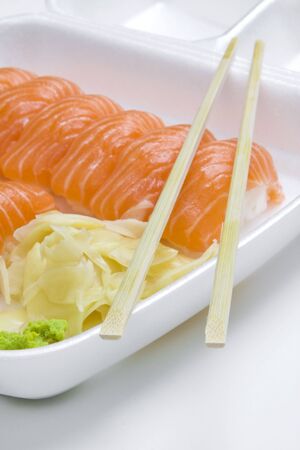 plastic white take-away box of salmon sushiの写真素材