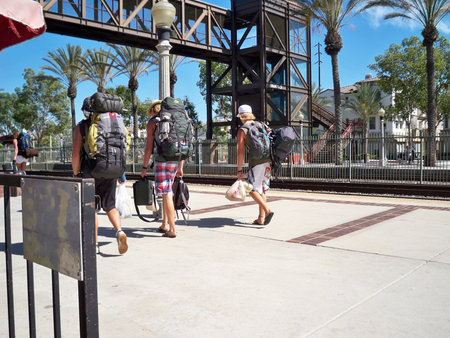 FULLERTON, CALIFORNIA/USA â March 8: Three young men walking on train station platform on March 8, 2008.のeditorial素材