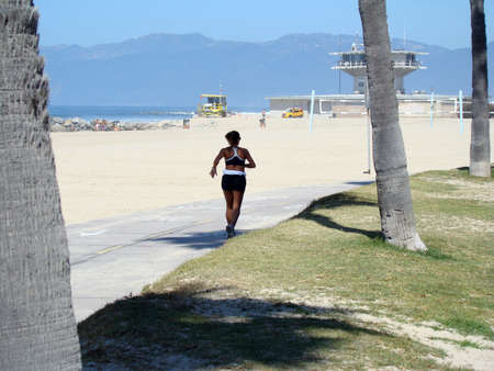 VENICE BEACH, CALIFORNIA/USA â MARCH 10: An image of female runner at Venice Beach California on March 10, 2008.のeditorial素材