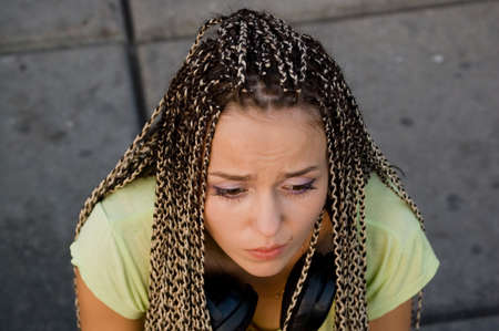 sadness beauty girl on a stone backgroundの写真素材