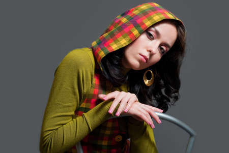 beauty girl in  squared waistcoat on the gray backgroundの写真素材