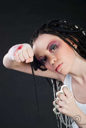 beauty girl with knuckleduster isolated on black backgroundの写真素材
