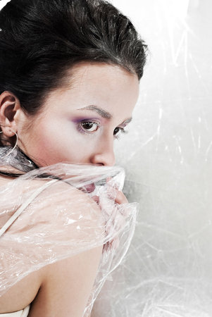 beauty young girl on the silver backgroundの写真素材