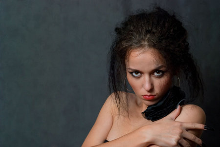 beauty young witch with black nails on gray backgroundの写真素材