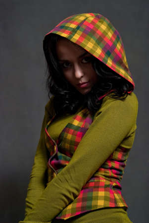 beauty girl in  squared waistcoat on the gray backgroundの写真素材