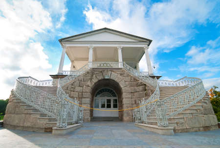 entrance to the museum with ancient stairs along the edges on the sky backgroundの写真素材