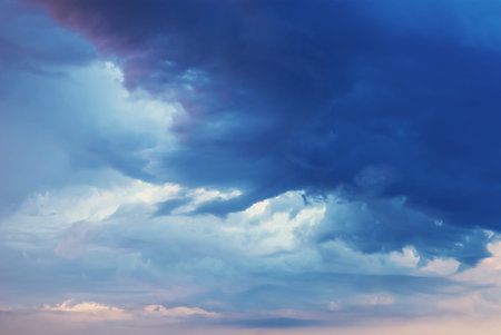 rays of light breaking through the blue cumulus cloud