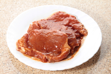 A cuisine photo of raw pork chopの写真素材
