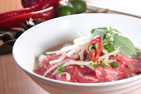 a cuisine photo of noodles with meat