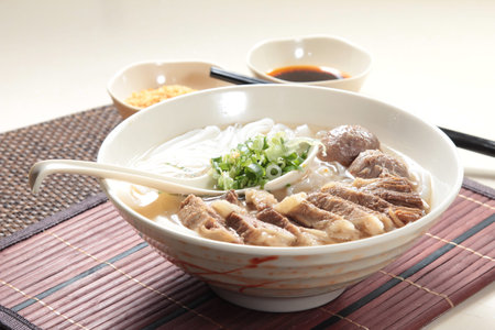a cuisine photo of noodles with meat