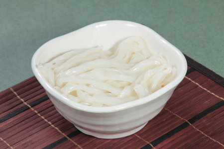a cuisine photo of noodles with meat