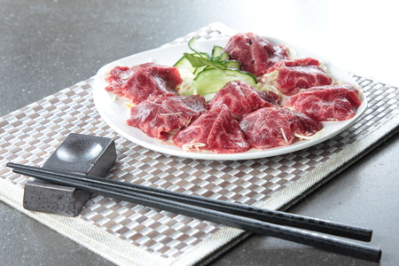 a cuisine photo of raw beefの写真素材