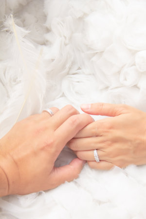 Wedding rings on the background of feathers. Wedding day.の写真素材