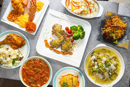Top view of a set of different dishes on a table in a restaurantの写真素材
