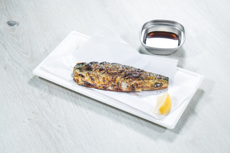 Grilled mackerel with sauce on white plate - Japanese food styleの写真素材