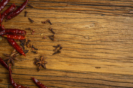 Various spices on a wooden background. Top view with copy space.の写真素材