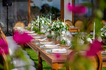 Wedding table setting with flowers and cutlery in restaurantの素材