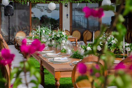 Table set for an event party or wedding reception in the garden.の素材