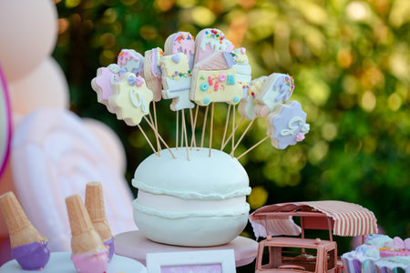 Wedding cake pops on a cake stand in the garden.の素材