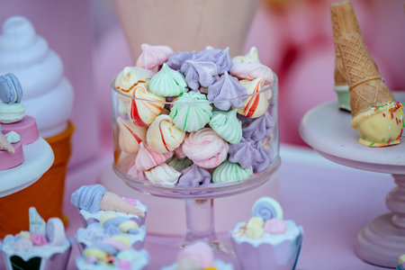 Colorful marshmallows on the table in a wedding candy barの素材