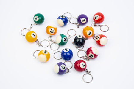 Beads and balls for playing billiards on a white backgroundの素材