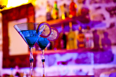 Cocktails on the bar counter in a nightclub. Shallow depth of fieldの素材