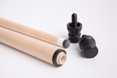 Wooden chopsticks and black plastic dowel on a white backgroundの素材
