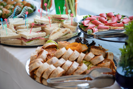 catering buffet with variety of food snacks and appetizers.の素材