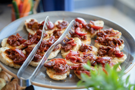 Bruschetta with meat and tomato sauce on a plate.の素材