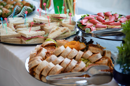 catering buffet with variety of food snacks and appetizers.の素材