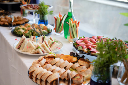 Catering buffet for events with a variety of food snacks.の素材